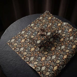 May include: A wrapped gift box and wrapping paper featuring a repeating pattern of vintage watch faces in shades of brown, beige, and gray. The gift is tied with a brown satin ribbon, creating a cohesive and thematic presentation.