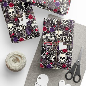 May include: Black and white wrapping paper with a repeating pattern of skulls, hearts, musical notes, guitars, and the word "EMO".