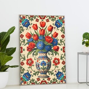 May include: A framed tile art piece featuring a floral arrangement. The artwork showcases red tulips and blue flowers in a decorative vase. The background is a cream color with a floral border in red, blue, and green.