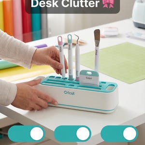 May include: A white and teal Cricut tool organizer with various crafting tools. The organizer has slots for tools and a scraper. Text on the image reads "Say Goodbye to Desk Clutter", "Adds Color to Your Space", "Tools Always Ready", and "Perfect for Crafters".