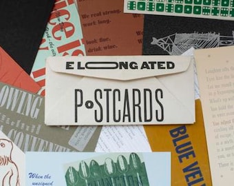 Puede incluir: Una colección de postales y efímeras. Una envoltura crema con las palabras "ELONGATED POSTCARDS" en letras negras en negrita es el punto focal. Varias tarjetas y papeles con texto y gráficos están dispersos alrededor.