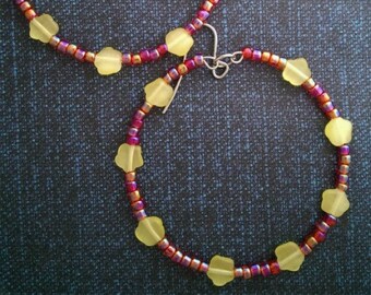 Fiery red beaded hoop with yellow floral beads