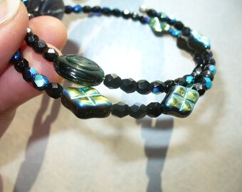 Iridescent aurora borealis black and silver shell double wrap bracelet on memory wire.