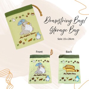 May include: A light green drawstring storage bag featuring a Totoro design. The front of the bag shows Totoro holding an umbrella, and the back shows the Catbus. The bag is 15 x 20cm.