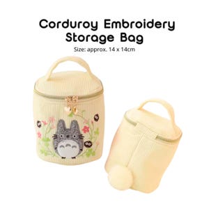 May include: Two light yellow corduroy storage bags with zipper closures and handles. One bag features an embroidered cartoon character and floral design. The text "CORDUROY EMBROIDERY STORAGE BAG" is at the top. Size: approx. 5.5 x 5.5 inches.
