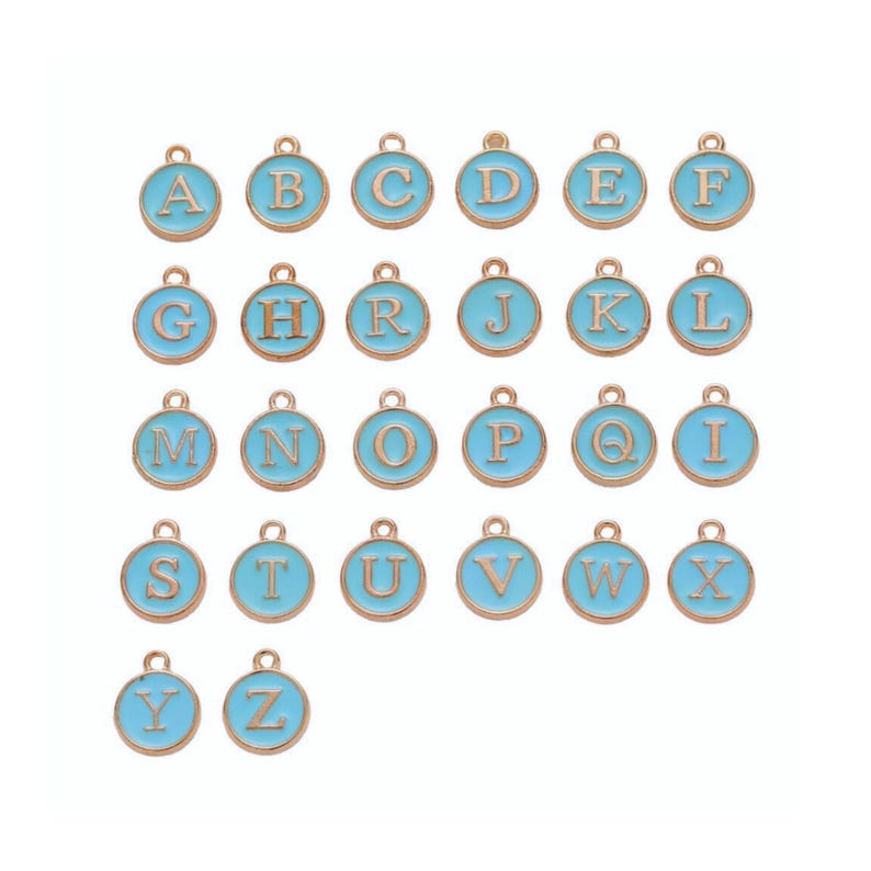 May include: A collection of gold-colored metal alphabet charms with a light blue enamel finish. Each charm features a different letter from A to Z, perfect for jewelry making or personalized crafts. The charms are round with a small loop at the top.