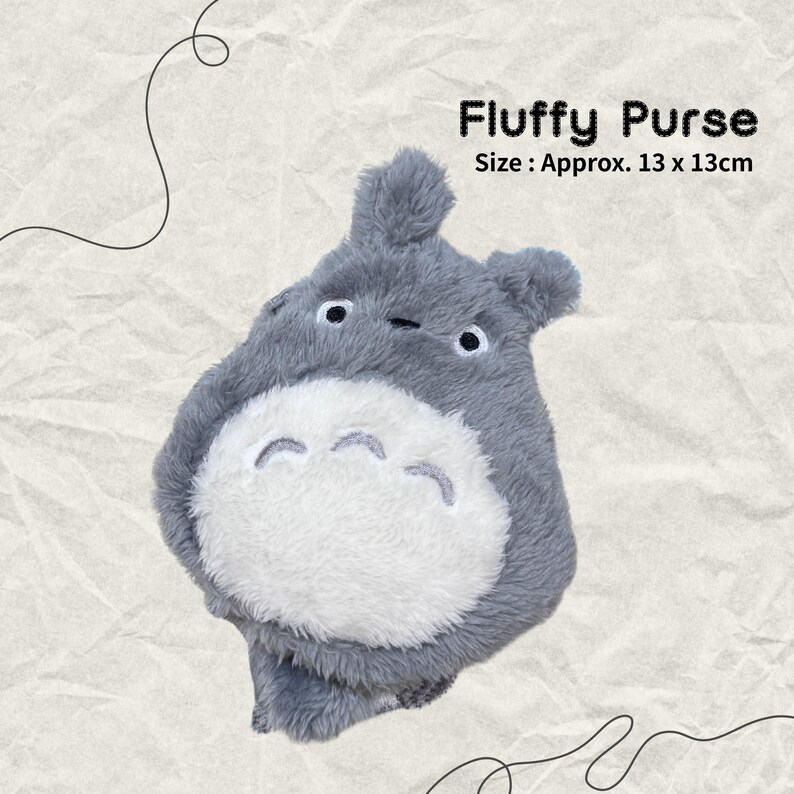 May include: Gray plush purse shaped like a cartoon character with large eyes and a white belly. The purse is about 13 inches by 13 inches. "Fluffy Purse" is written above the purse, and "Size: Approx. 13 x 13cm" is written below the purse.