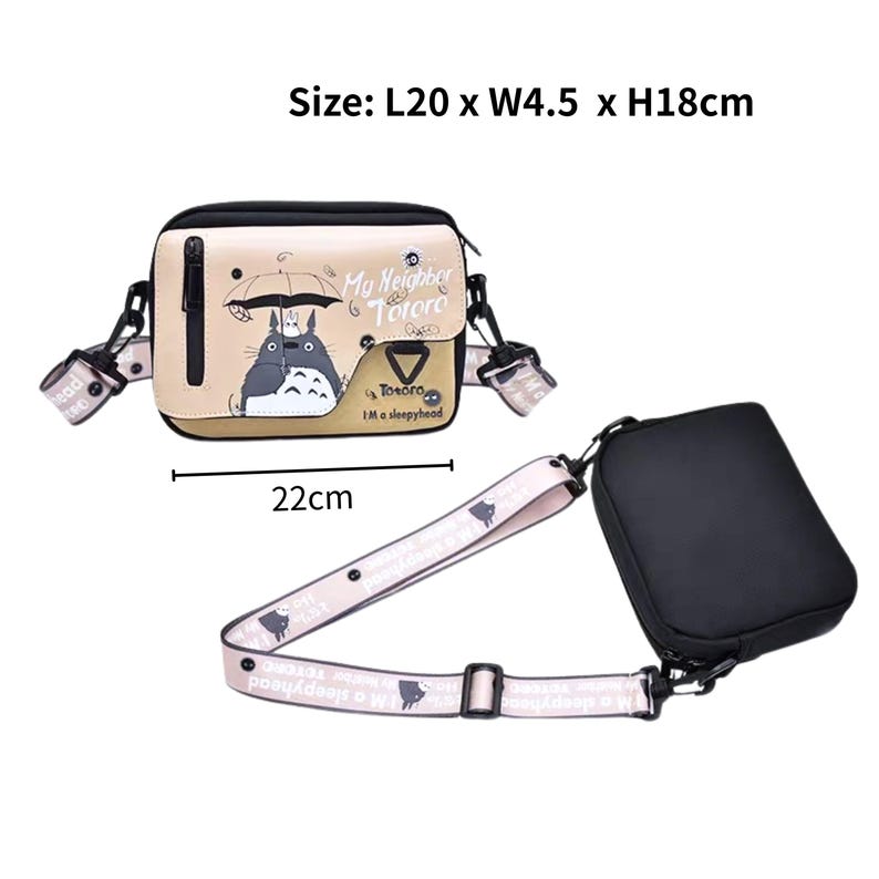 May include: A beige crossbody bag with a black top and a detachable strap. The bag features a graphic of Totoro with an umbrella and the text "My Neighbor Totoro". The bag measures 20cm long, 4.5cm wide, and 18cm high.