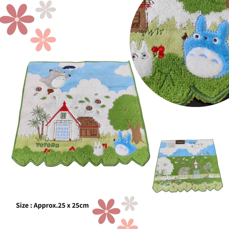 May include: A decorative, rectangular towel featuring a scene with cartoon characters, houses, and trees. The towel has a green scalloped border and a blue sky background. The text "TOTORO" is visible. Approximate size: 9.8 x 9.8 inches.
