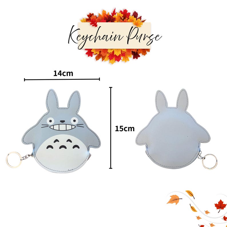 May include: A light blue keychain purse shaped like a cartoon character, with a smiling face and a white belly. The purse is 5.5 inches wide and 5.9 inches tall. The text "Keychain Purse" is above the purse.