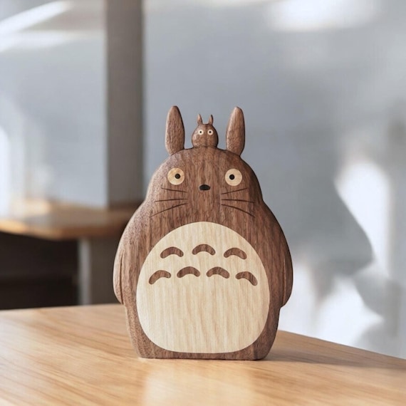 Someone hand-carved Totoro out of solid walnut — it's a sculpture masquerading as a pen holder, and the 54 favorites confirm people stop in their tracks.