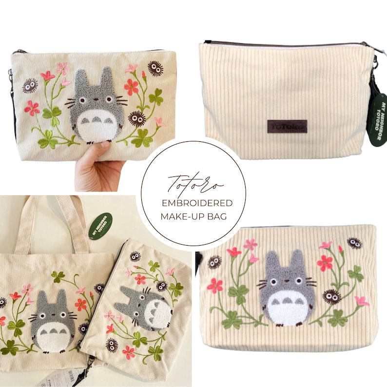 May include: Cream corduroy makeup bag with an embroidered Totoro design. The design features a grey Totoro character surrounded by pink flowers and green vines. The bag has a black zip and a small tag.