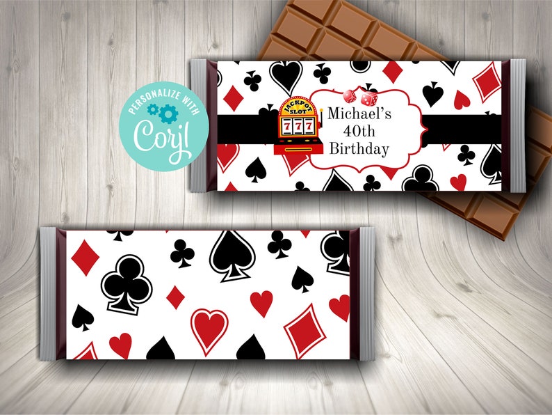 May include: A white chocolate bar wrapper with a red, black, and white playing card pattern. The wrapper has a black banner with the text "Michael's 40th Birthday".