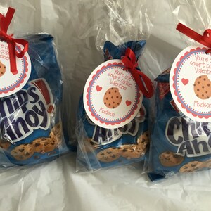 May include: Three bags of Chips Ahoy chocolate chip cookies with red and white Valentine's Day gift tags attached. The tags have a cookie image and the text "You're one smart cookie, Valentine!" with the name "Madison" printed below.