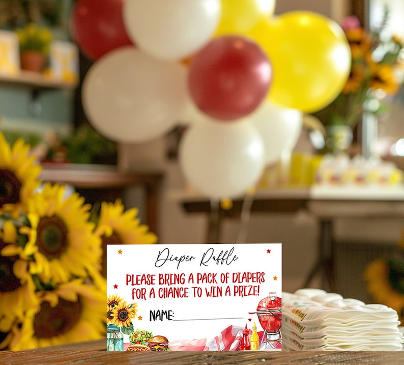 May include: A white card with red and gold stars, a red and white checkered background, and a grill, ketchup, mustard, and a hamburger. The text on the card reads "Diaper Raffle" and "Please bring a pack of diapers for a chance to win a prize!" There is a blank line for a name.