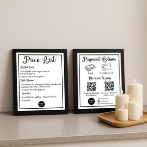 May include: Two framed price lists and payment options signs with black frames. The price list includes items like knitted scarves, table runners, and sweaters. The payment options sign shows cash, credit card, and QR codes.