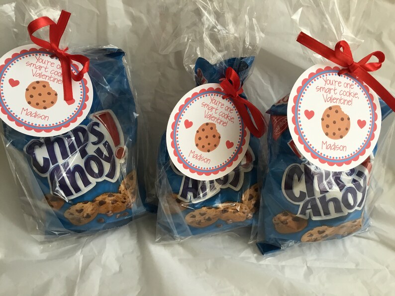 May include: Three bags of Chips Ahoy chocolate chip cookies with red and white Valentine's Day gift tags attached. The tags have a cookie image and the text "You're one smart cookie, Valentine!" with the name "Madison" printed below.