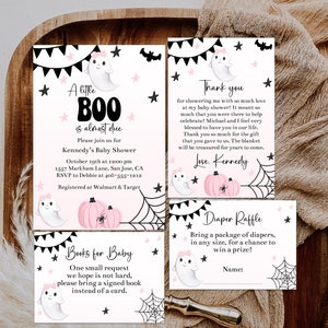May include: Baby shower invitations and cards with a Halloween theme. The invitations feature a ghost, pink pumpkins, and the text "A little Boo is almost due." Includes a thank you card and a diaper raffle card.
