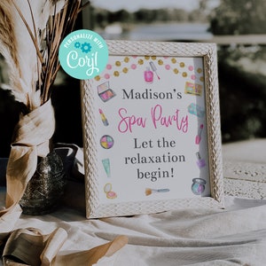 May include: A white framed sign with a pink and gold background. The sign says "Madison's Spa Party" and "Let the relaxation begin!" with images of makeup and spa items.