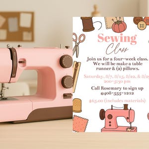 May include: A pink sewing machine with brown details is positioned on a light wood surface, beside a flyer promoting a sewing class. The flyer features illustrations of sewing tools and the words "Sewing Class".