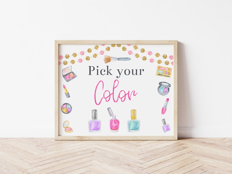 May include: A printable sign with the text "Pick your Color" in pink and black lettering. The sign is decorated with watercolor illustrations of makeup items, including nail polish, lipstick, eyeshadow, and a makeup brush. The sign is surrounded by a gold and pink garland.