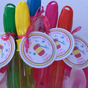 May include: A set of five colorful bubble wands with attached tags that read "I hope your summer is full of bubbles with fun!" and "From, Madison".