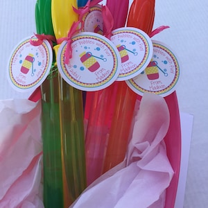 May include: A set of colorful bubble wands with attached tags that read "I hope your summer is filled with bubbles and fun! From, Madison".