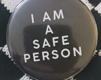 May include: A black button with white text that reads "I AM A SAFE PERSON".