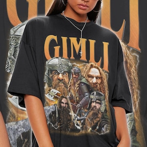 May include: Black t-shirt with a graphic print of the character Gimli from the Lord of the Rings movie franchise. The graphic features a collage of Gimli's face and other dwarves from the movie.