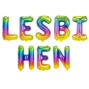 May include: Rainbow-colored foil balloons spelling out the word "LESBIHEN". The balloons are in the shape of individual letters, with a gradient of colors including yellow, green, blue, purple, and pink.
