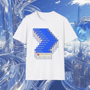 May include: White t-shirt featuring a blue and white graphic of multiple "Reality.exe" error windows. The error message "Reality.exe has stopped working" is displayed in a pop-up window. The shirt has a crew neck and short sleeves.