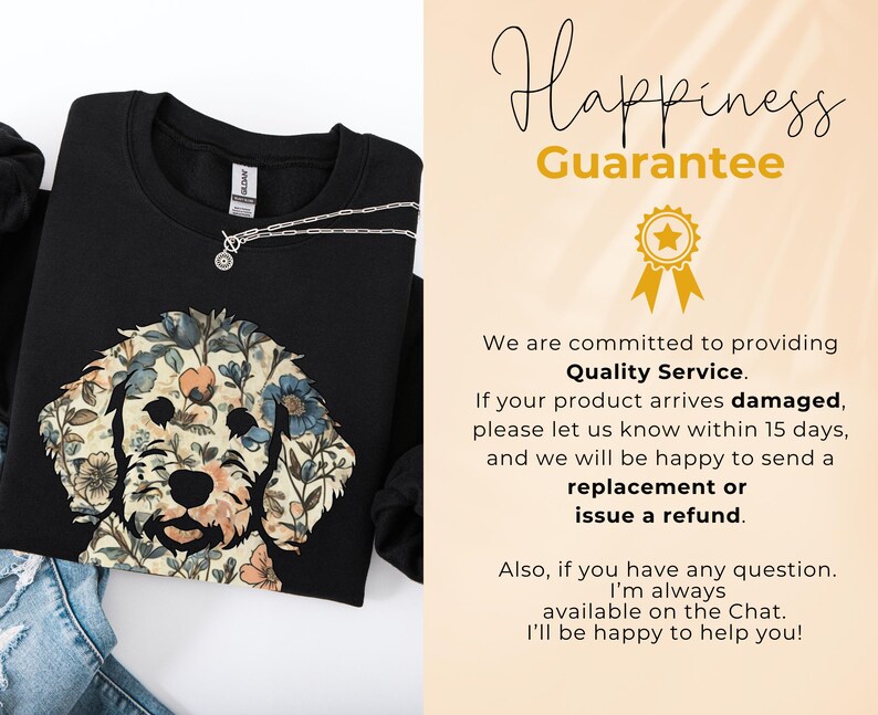 May include: Black sweatshirt featuring a floral dog design in beige, blue, and peach tones. A silver necklace with a small pendant is visible. The image also includes text that reads "Happiness Guarantee."