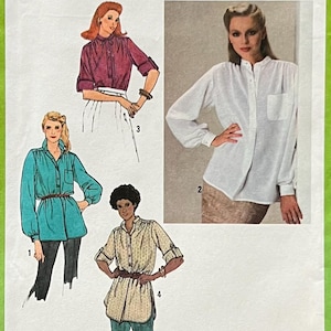 May include: A vintage Simplicity sewing pattern envelope, featuring illustrations of women's blouses. The pattern number is 9234, size 14 Miss. The envelope has a green border and includes the text "Simplicity Fashion News".