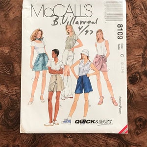 May include: McCall's sewing pattern 8109 featuring illustrations of shorts and tops. The pattern includes the text "QUICK & EASY" and the designer's name, B. Villarreal, with a copyright date of 1997. The size is C (10,12,14).