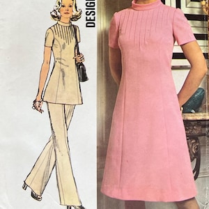 May include: Vintage Simplicity Designer Fashion sewing pattern, size 14, featuring a pink dress and a beige pantsuit. The pattern envelope includes the number 5345 and the text "Designer Fashion". Bust 36 inches, waist 28 inches.