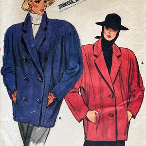May include: A Very Easy Very Vogue sewing pattern envelope 9381 for sizes 8-10-12. The front features illustrations of two double-breasted jackets: one in blue with a white turtleneck and one in red with a black turtleneck and a black hat.