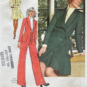 May include: Vintage Simplicity sewing pattern envelope featuring illustrations of women's fashion. The envelope includes a red and white patterned pantsuit, a yellow skirt suit, and a green polka dot dress. The text reads "Young Contemporary Fashion."