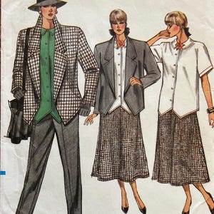 May include: Vogue Patterns sewing pattern featuring illustrations of three different outfits. The outfits include a houndstooth blazer and pants, a gray blazer and skirt, and a white short-sleeve shirt and skirt. The pattern size is 8-10-12.