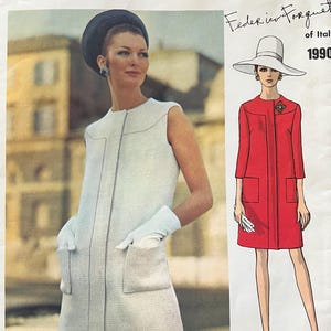 May include: A Vogue Couturier Design sewing pattern envelope featuring a sleeveless white shift dress with front pockets and a matching pillbox hat. The illustration shows a red coat dress with a wide-brimmed hat, labeled Federico Forquet of Italy 1990.