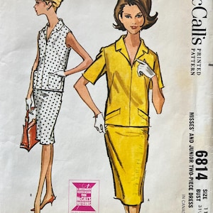 May include: A handmade wooden sign with the text "Welcome" in a handwritten style. The sign is painted white with a distressed finish, and a small green leaf is attached to the top. The sign is designed for indoor or outdoor use.