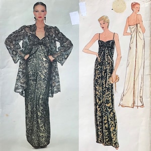 May include: A Vogue Paris Original sewing pattern envelope for Yves Saint Laurent design 2183. The cover features a photograph of a floor-length black lace dress and matching jacket, alongside two fashion illustrations of the same garment design.