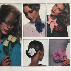 May include: Vogue Patterns 1633. The image shows a vintage pattern cover with multiple images of women wearing floral accessories. The accessories include fabric flowers and a bow. The cover has the Vogue Patterns logo and the number 1633.