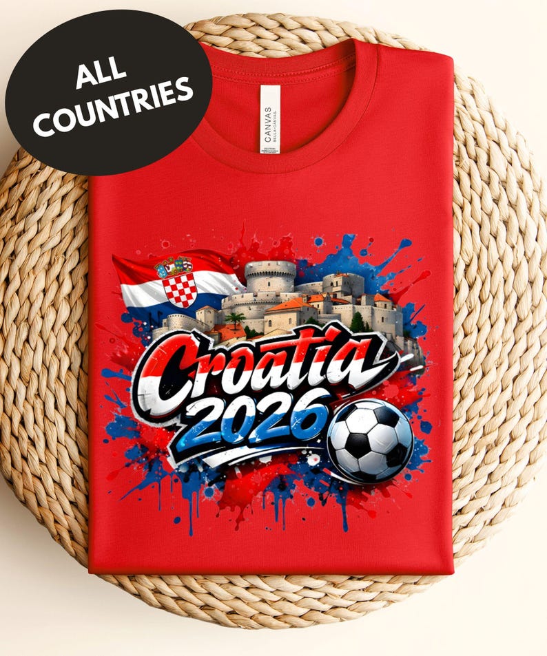 A red t-shirt with a graphic design featuring the text "Croatia 2020" and a soccer ball, along with a flag and splatter-like elements.