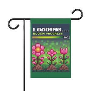 May include: A green garden flag with a pixelated design of flowers growing. The flag reads "LOADING... BLOOM PROGRESS 50%" with a green progress bar.