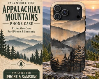 May include: A phone case featuring a faux wood effect with a printed landscape of the Appalachian Mountains, showcasing layered mountain ridges, a misty forest of pine trees, and a sunset sky. The case has a black camera cutout area.