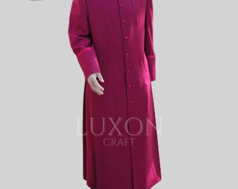 May include: A long, burgundy cassock with a stand-up collar and button closure. The cassock has a white lining on the cuffs and a white collar.