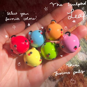 Junimo apple garden pals! mini handmade ceramic decorations for your desk, gaming setup, bookcase, plants etc. | inspired by Stardew Valley!