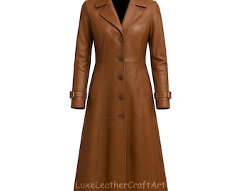 May include: A long, brown leather coat with a classic design. The coat features a notched collar, button-down front, and two front pockets. The sleeves have adjustable cuffs. The text "LuxeLeatherCraftArt" is printed at the bottom.