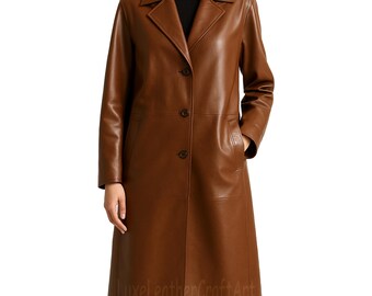 May include: A brown leather coat with a classic design. The coat features a notched collar, button closure, and pockets. The coat is knee-length and has a tailored fit. The text "LuxeLeatherCraftArt" is visible at the bottom of the coat.