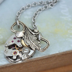 TINY TIME TRAVELER antiqued silver steampunk watch movement necklace with tiny leaf